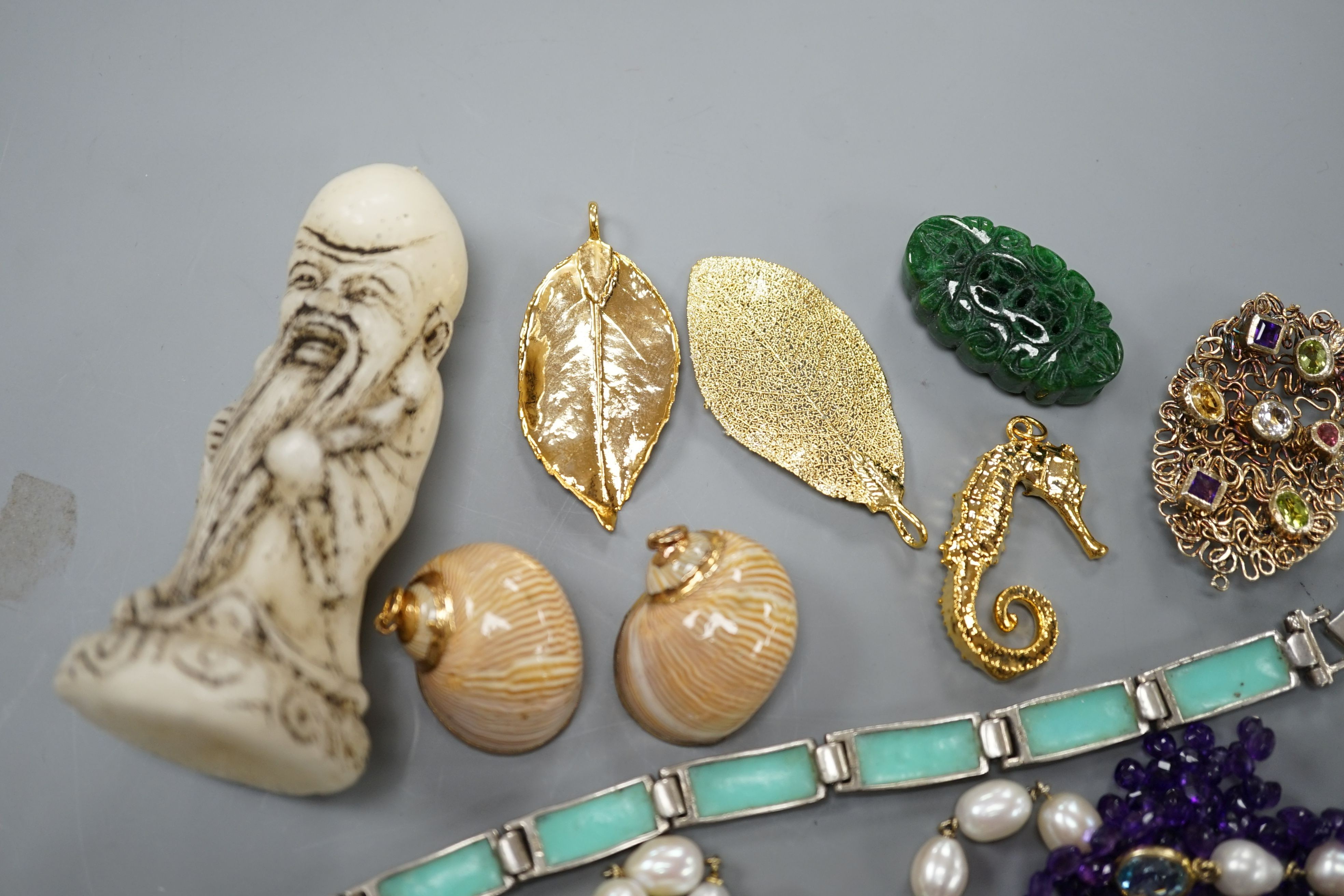 A group of minor costume jewellery including an amethyst bead necklace